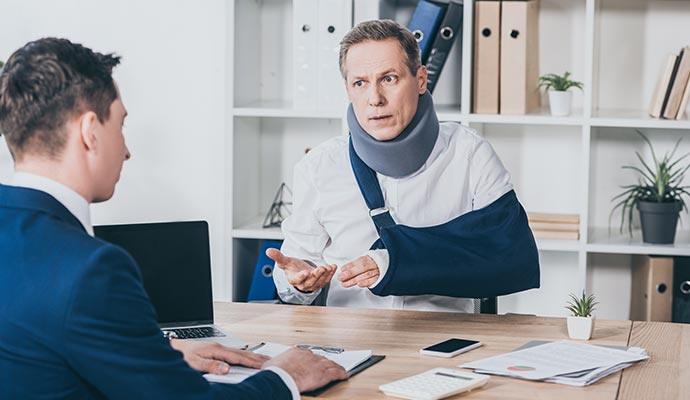 Injured person consulting with lawyer